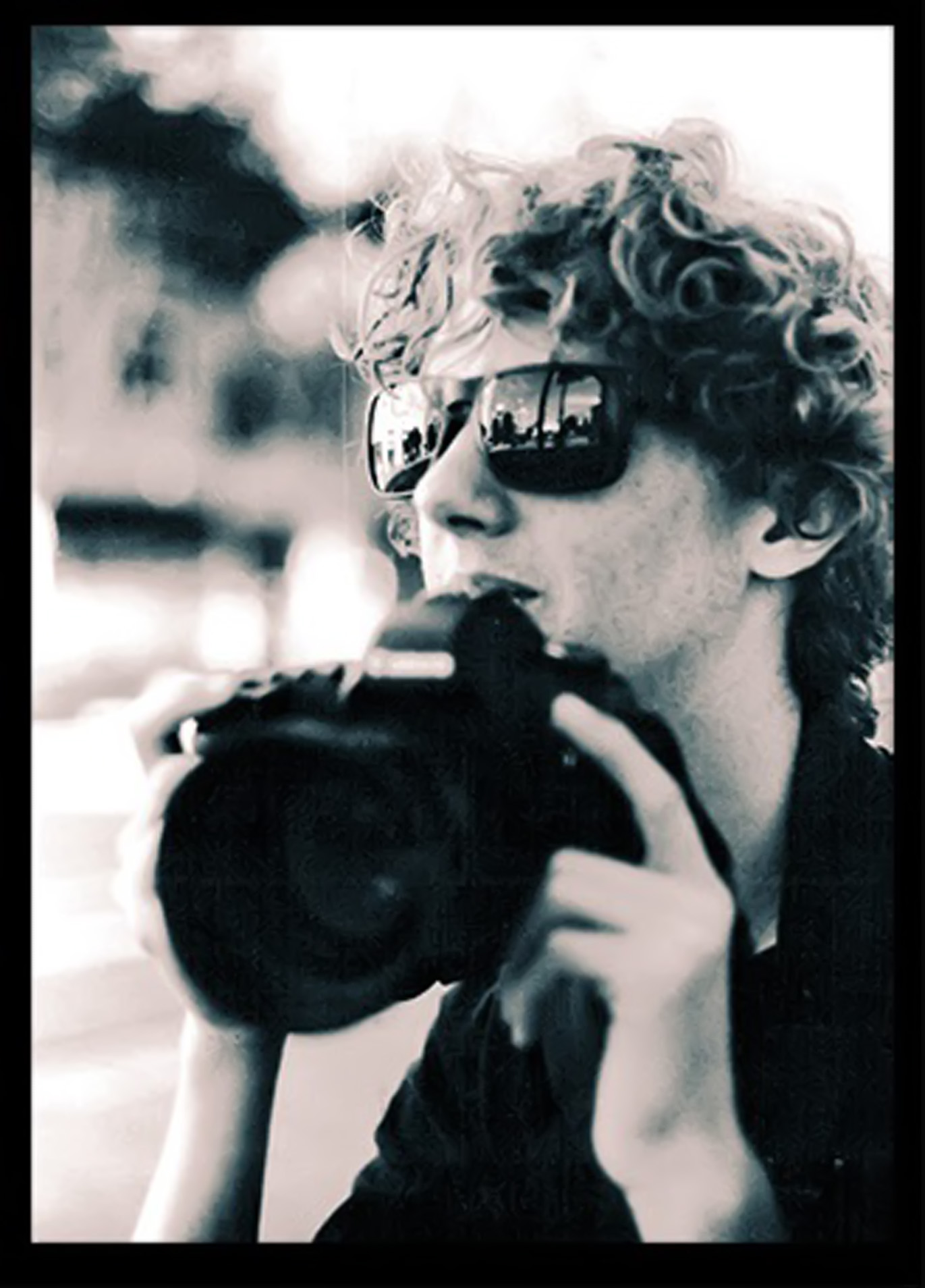 black & white photo of Carson with his camera